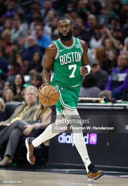 Jaylen Brown of the Boston Celtics dribbles the ball up court against the Sacramento Kings during the first half of an NBA basketball game at Golden...