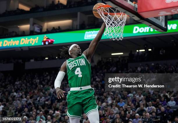 Jrue Holiday of the Boston Celtics goes up for a layup on a fast break against the Sacramento Kings during the first half of an NBA basketball game...