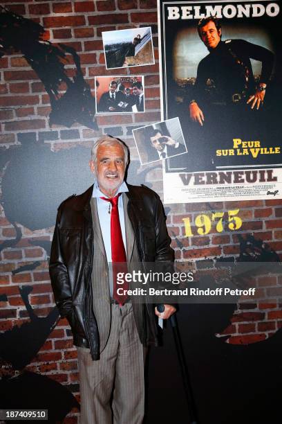 Legendary actor Jean-Paul Belmondo poses by a poster of the 1975 thriller "Peur sur la ville" by Henri Verneuil, in which he stars a Paris police...