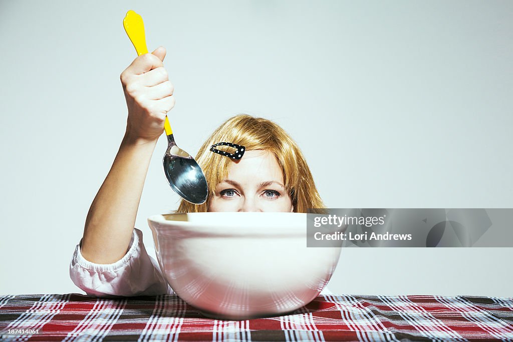 Woman eating from large bowl