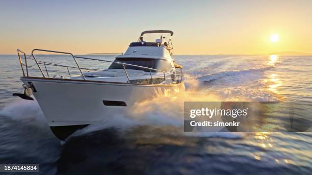 couple sailing yacht over ocean - luxury yacht stock pictures, royalty-free photos & images