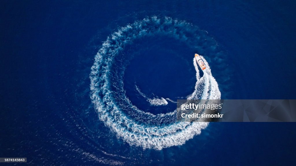 Yacht cruising fast in sea