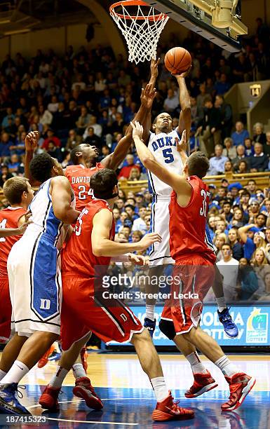 Rodney Hood of the Duke Blue Devils drives to the basket against Chris Czerapowicz of the Davidson Wildcats during their game at Cameron Indoor...