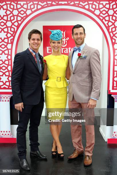 Emirates Stakes Day Fashions on the Field Ambassador Johnny Ruffo, Jacqui Felgate and Shura Taft pose at the Fashion on the Field stage during...