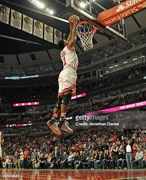 Derrick Rose of the Chicago Bulls dunks against the Utah Jazz at the United Center on November 8, 2013 in Chicago, Illinois. NOTE TO USER: User...