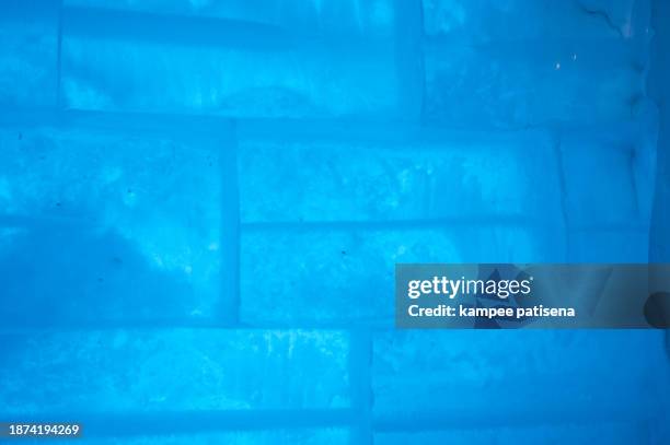 wall composed of bricks of ice, full frame - melting snowball stock pictures, royalty-free photos & images