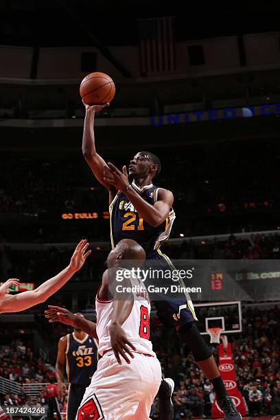 Ian Clark of the Utah Jazz shoots against Mike James of the Chicago Bulls on November 8, 2013 at the United Center in Chicago, Illinois. NOTE TO...