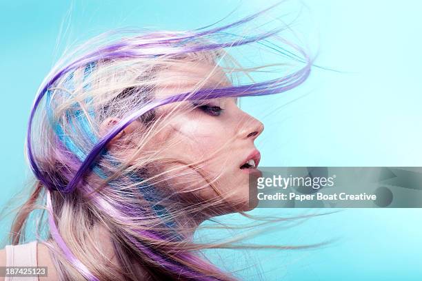lady with colorful hair flying over her face - purple hair fotografías e imágenes de stock