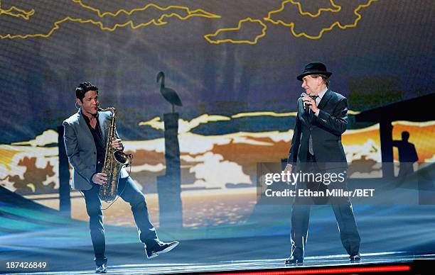 Musician Dave Koz and singer/songwriter Bobby Caldwell perform onstage at the Soul Train Awards 2013 at the Orleans Arena on November 8, 2013 in Las...