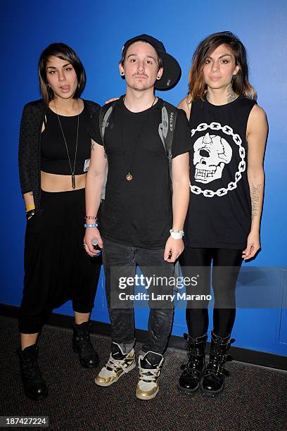 Yasmine Yousaf, Kris Trindl and Jahan Yousaf of Krewella pose for a portrait at Y 100 radio station on November 8, 2013 in Miami, Florida.