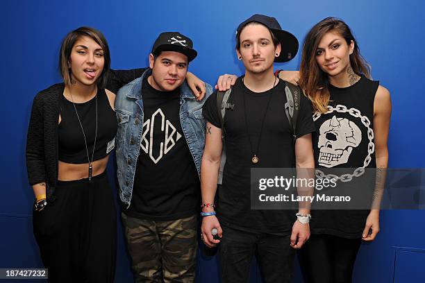 Yasmine Yousaf, Kris Trindl and Jahan Yousaf of Krewella pose with DJ Mack at Y 100 radio station on November 8, 2013 in Miami, Florida.