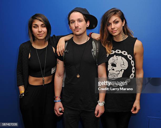 Yasmine Yousaf, Kris Trindl and Jahan Yousaf of Krewella pose for a portrait at Y 100 radio station on November 8, 2013 in Miami, Florida.