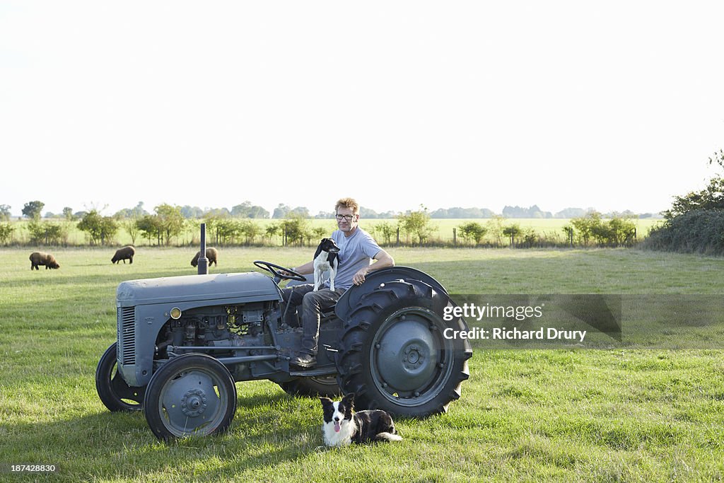 Smallholder on his farm with his dogs