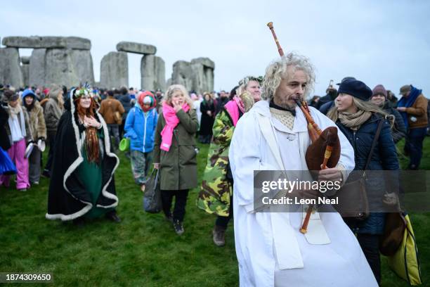 Piper walks from the standing stones at Stonehenge following sunrise on Winter Solstice on December 22, 2023 in Wiltshire, England. The Winter...