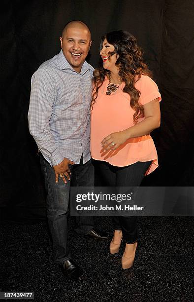 Two time world champion boxer Fernando Vargas and his wife Martha Lopez Vargas pose for pictures at the Getty Images offices on November 8, 2013 in...