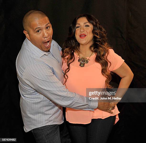 Two time world champion boxer Fernando Vargas and his wife Martha Lopez Vargas pose for pictures at the Getty Images offices on November 8, 2013 in...