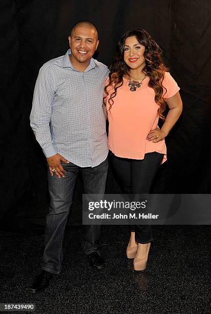 Two time world champion boxer Fernando Vargas and his wife Martha Lopez Vargas pose for pictures at the Getty Images offices on November 8, 2013 in...