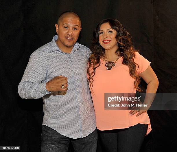 Two time world champion boxer Fernando Vargas and his wife Martha Lopez Vargas pose for pictures at the Getty Images offices on November 8, 2013 in...