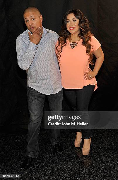 Two time world champion boxer Fernando Vargas and his wife Martha Lopez Vargas pose for pictures at the Getty Images offices on November 8, 2013 in...