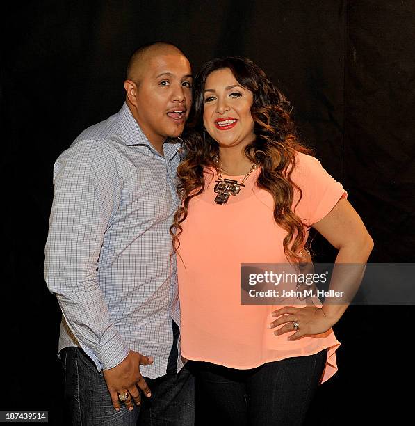 Two time world champion boxer Fernando Vargas and his wife Martha Lopez Vargas pose for pictures at the Getty Images offices on November 8, 2013 in...