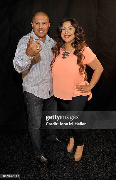 Two time world champion boxer Fernando Vargas and his wife Martha Lopez Vargas pose for pictures at the Getty Images offices on November 8, 2013 in...