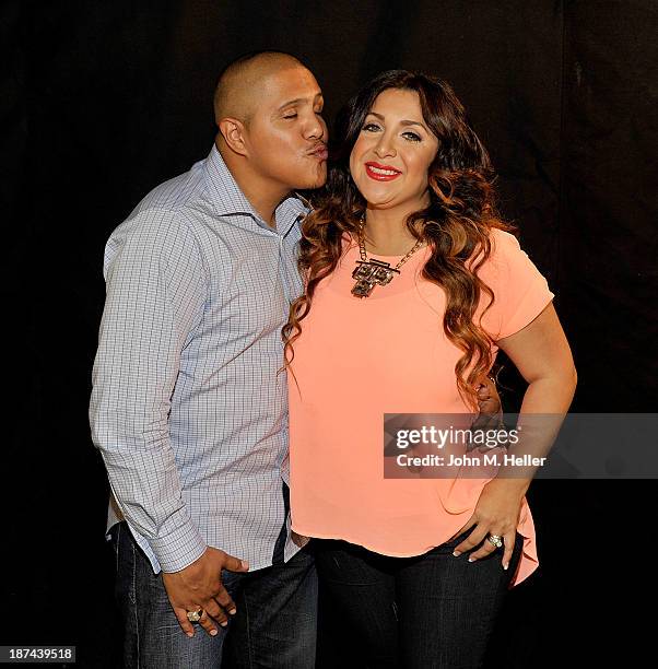 Two time world champion boxer Fernando Vargas and his wife Martha Lopez Vargas pose for pictures at the Getty Images offices on November 8, 2013 in...