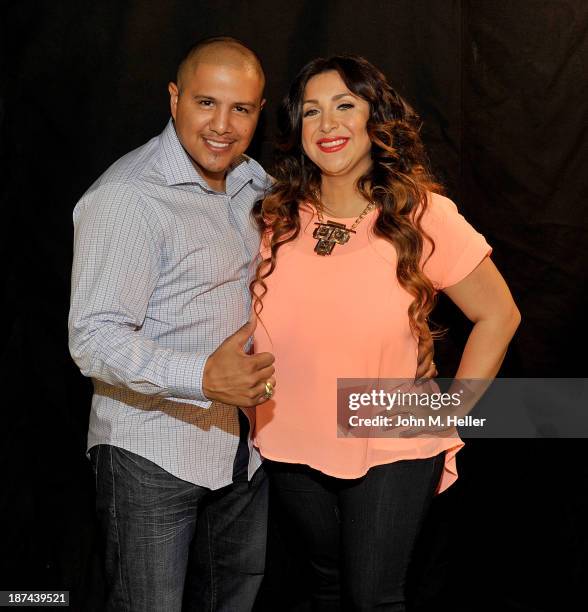 Two time world champion boxer Fernando Vargas and his wife Martha Lopez Vargas pose for pictures at the Getty Images offices on November 8, 2013 in...