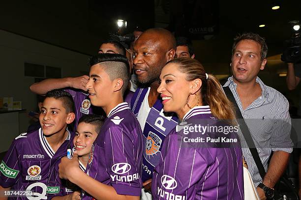 New Perth Glory A-League recruit William Gallas stops for photos with Glory supporters after arriving at Perth International Airport on November 9,...