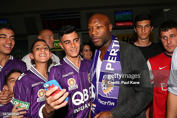 New Perth Glory A-League recruit William Gallas stops for photos with Glory supporters after arriving at Perth International Airport on November 9,...