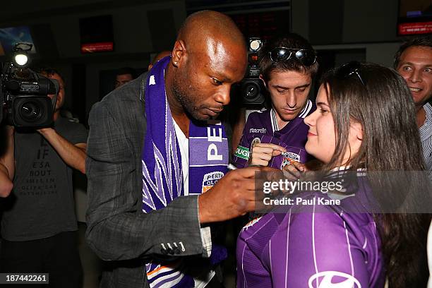 New Perth Glory A-League recruit William Gallas stops to sign autographs for Glory supporters after arriving at Perth International Airport on...