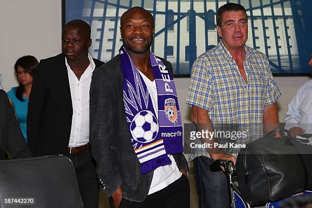 New Perth Glory A-League recruit William Gallas walks into the arrivals hall after arriving at Perth International Airport on November 9, 2013 in...