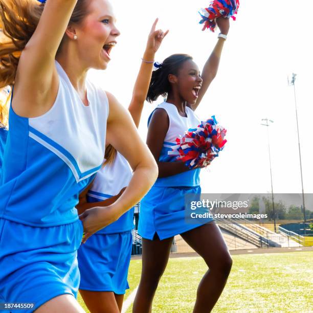 football cheerleaders - white pom pom stock pictures, royalty-free photos & images