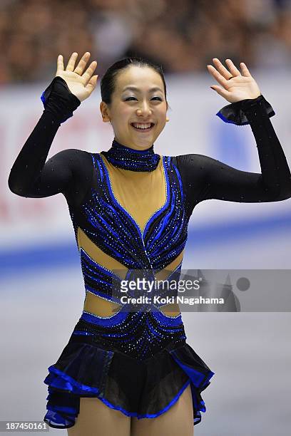 Gold medalist Mao Asada of Japan waves to fans during day two of ISU Grand Prix of Figure Skating 2013/2014 NHK Trophy at Yoyogi National Gymnasium...