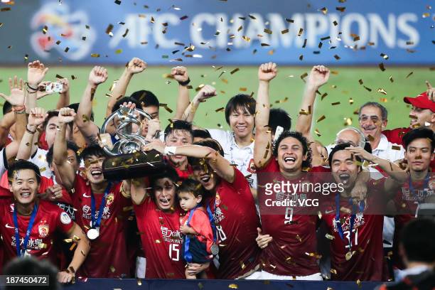 Guangzhou Evergrande players celebrate with the trophy after winning the AFC Champions League Final 2nd leg match against FC Seoul at Tianhe Sports...