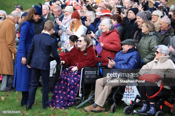 Catherine, Princess of Wales and Prince George greet well-wishers after attending the Christmas Morning Service at Sandringham Church on December 25,...