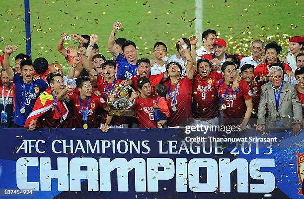 Guangzhou Evergrande players celebrate with the AFC Champions League Final Tropy after winning the 2013 AFC Champions League final at Guangzhou...