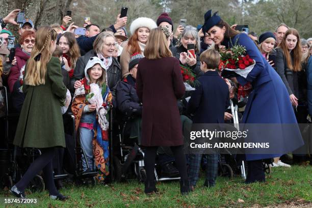 Britain's Catherine, Princess of Wales , Britain's Prince Louis of Wales , Mia Tindall and Britain's Princess Charlotte of Wales chat with...