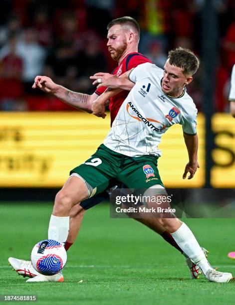 Callum Timmins of the Jets competes with Ryan Tunnicliffe of Adelaide United during the A-League Men round nine match between Adelaide United and...