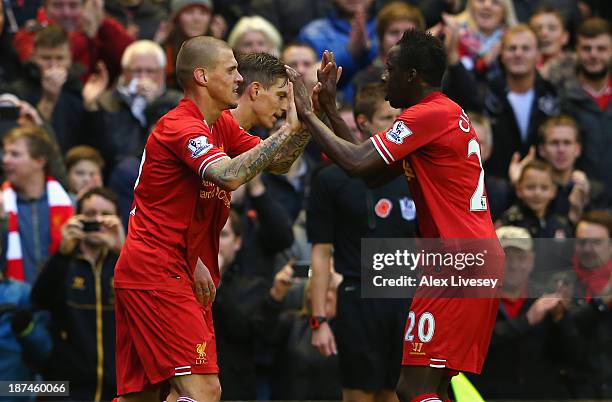 Martin Skrtel of Liverpool celebrates scoring the second goal with his team-mate Aly Cissokho during the Barclays Premier League match between...