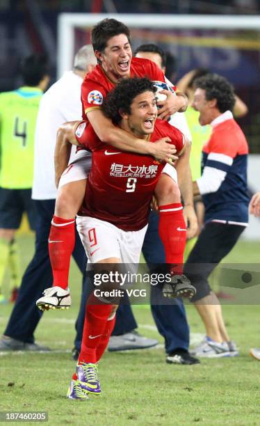 Dario Conca and Elkeson of Guangzhou Evergrande celebrate after winning the AFC Champions League Final 2nd leg match against FC Seoul at Tianhe...