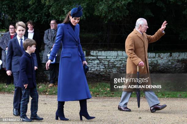 Britain's Catherine, Princess of Wales walks away from the church with Britain's Prince George of Wales and Britain's Prince Louis of Wales as...