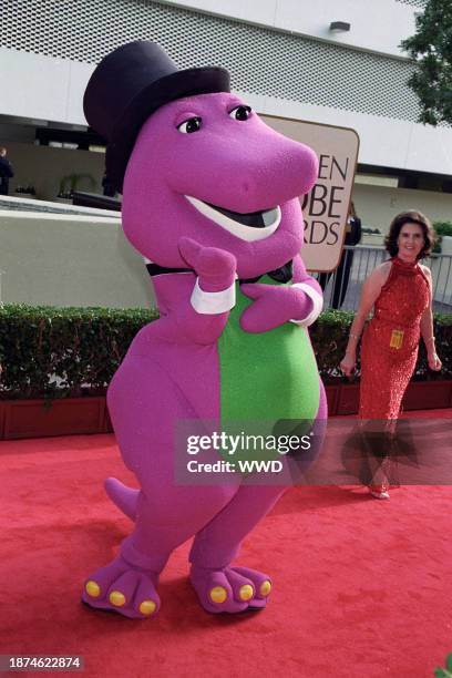 Barney the big purple dinosaur attends the Golden Globe awards on January 18, 1998 in Los Angeles, California. Article title: "Eye: Spanning the...