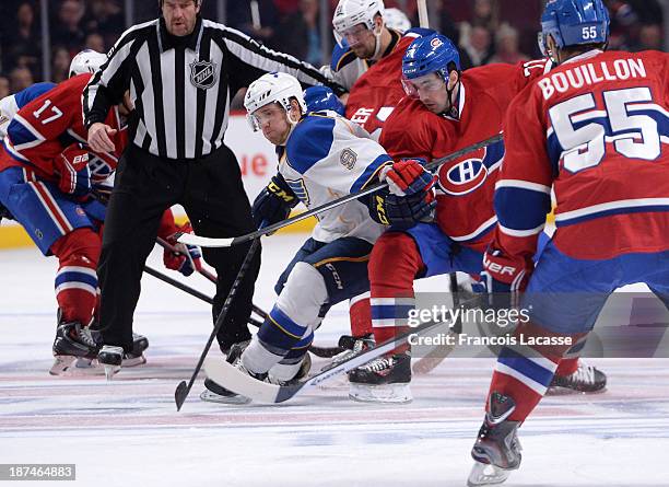 Louis Leblanc of the Montreal Canadiens and Jaden Schwartz of the St. Louis Blues battle for position during the NHL game on November 5, 2013 at the...