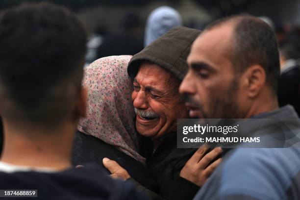 Palestinians mourn their relatives, killed in an overnight Israeli strike on the Al-Maghazi refugee camp, during a mass funeral at the Al-Aqsa...