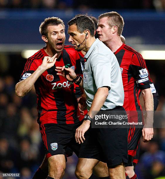 West Brom's Gareth McAuley appeals to referee Andre Marriner after he awards a late penalty to Chelsea during the Barclays Premier League match...