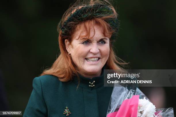 Sarah, Duchess of York smiles outside after attending the Royal Family's traditional Christmas Day service at St Mary Magdalene Church on the...