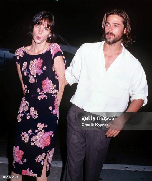 American actor Brad Pitt with actress Juliette Lewis at the Beverley Hills premiere of 'Johnny Suede', 19th August 1992.