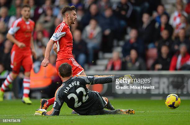Steve Harper of Hull City brings down Adam Lallana of Southampton to concede a penalty during the Barclays Premier League match between Southampton...