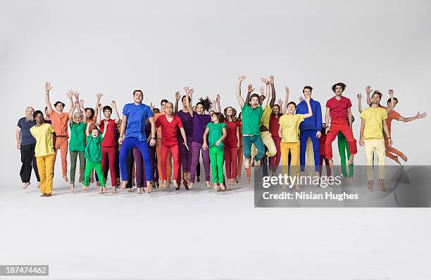 group of people jumping happily - gente en fila fotografías e imágenes de stock