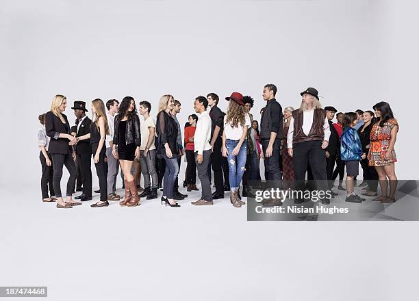 large group of people standing together talking - large group of people white background stock pictures, royalty-free photos & images